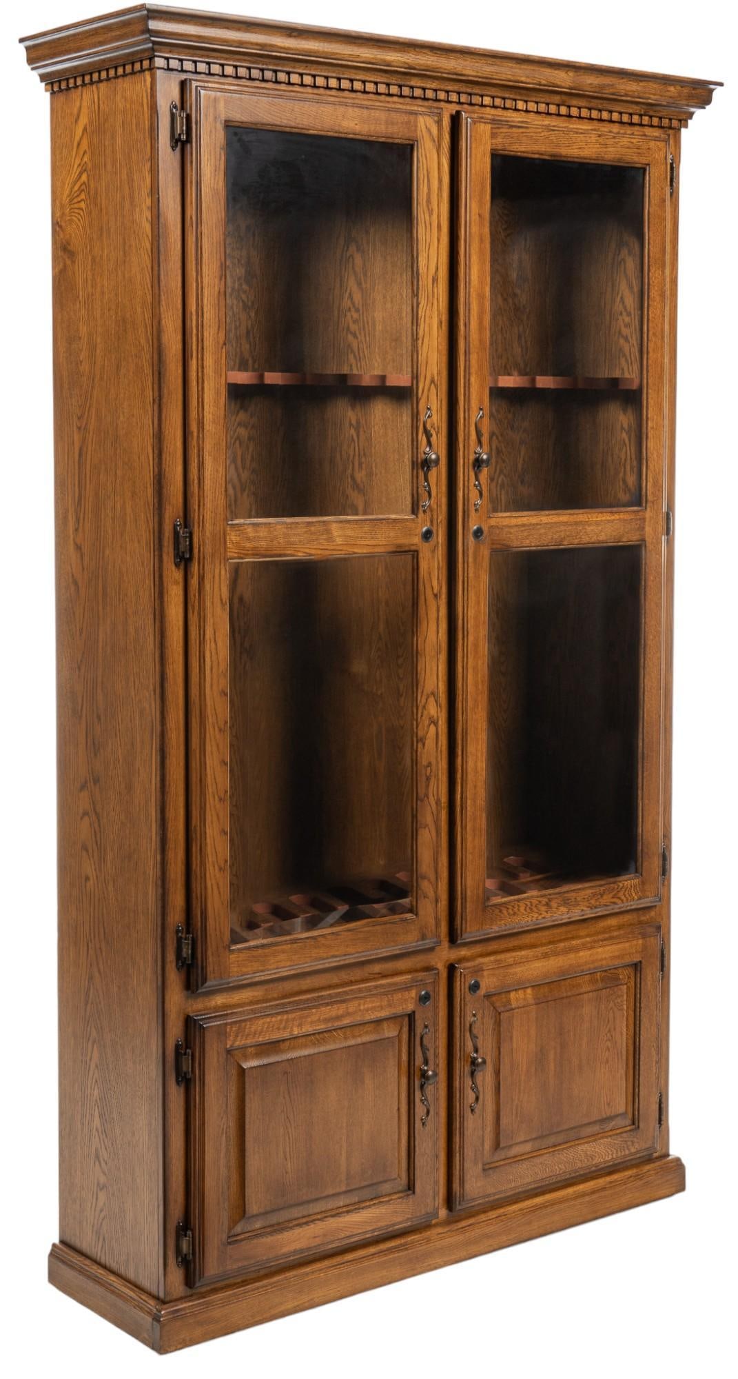 Gun Cabinet: Wooden gun cabinet featuring pair of glass doors that open to interior storage equipped to store and display ten rifles over pair of lower cabinet doors that open to shelved interior storage height 7