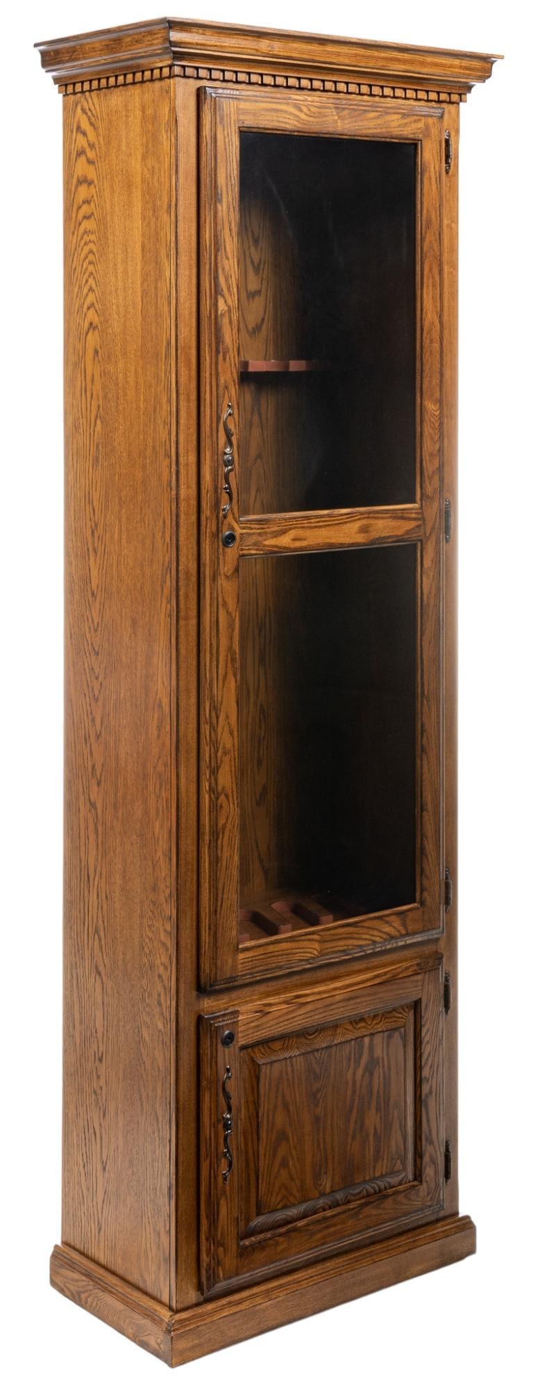 Gun Cabinet: Wooden gun storage / display cabinet with glass door opening to internal storage equipped to store up to five rifles, over bottom cabinet door that opens to shelved interior space height 77.25 in. x w