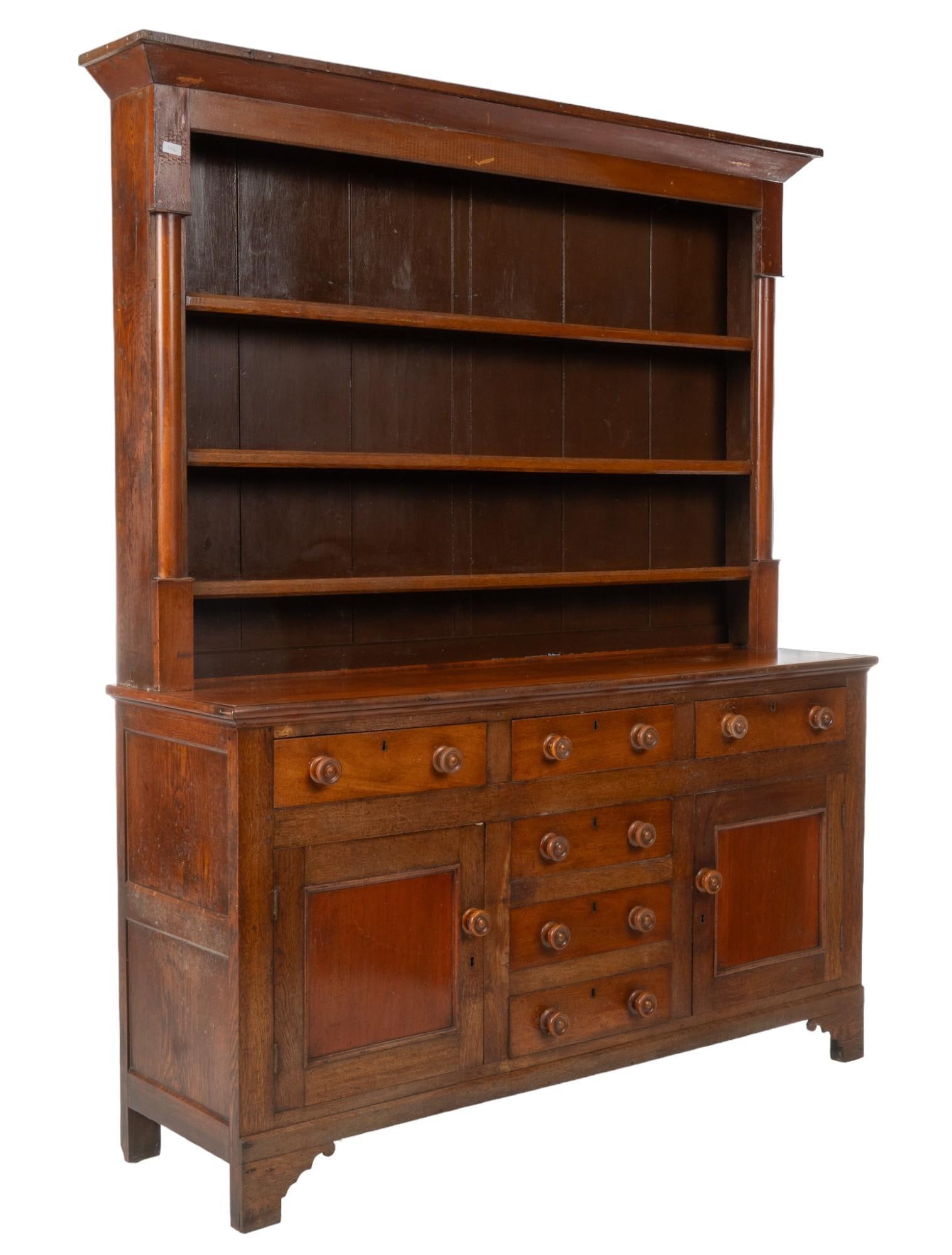 George III Dresser: George III dresser featuring four wooden shelves, six lower drawers with wooden pulls, and two cabinets with wooden pulls, no key height 84 in. x width 72 in. x depth 19 in. Shipping available for thi