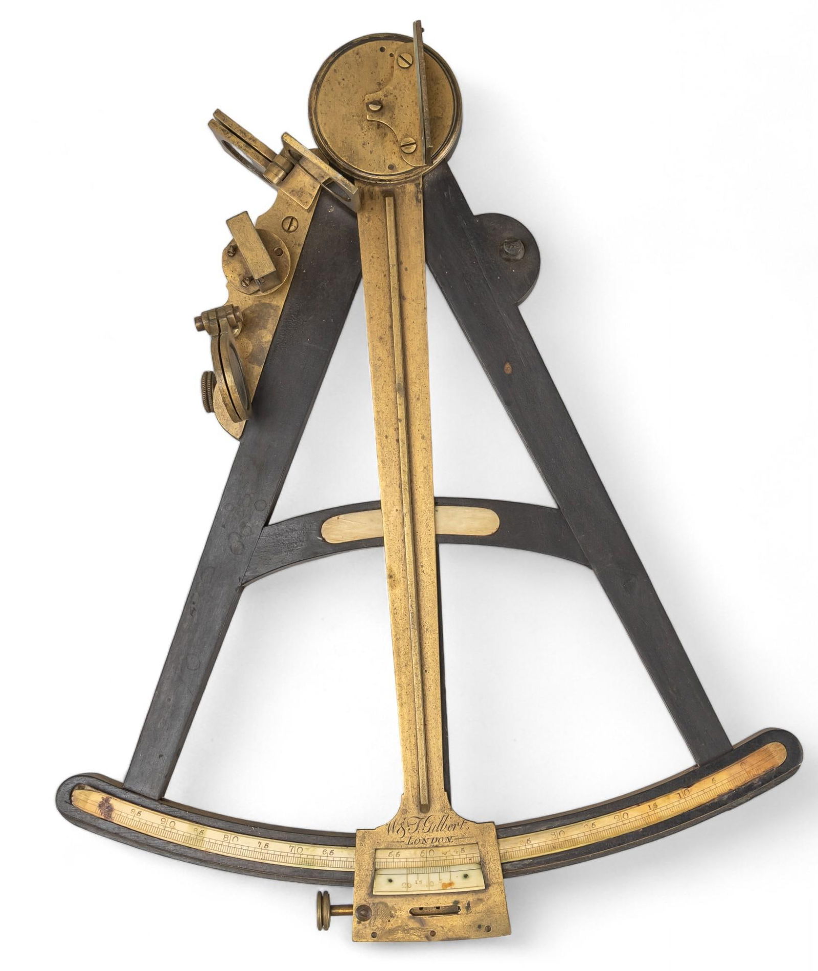 W & J Gilbert Octant: Ebony and brass T-frame octant by W & J Gilbert (London, England) with bone inlaid scale, 18th century height 14 in. x width 11 in. x depth 3 in. Shipping available for this lot through our par