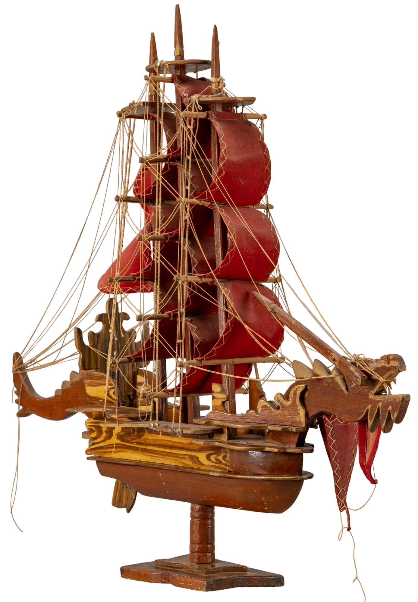 Vintage Wooden Pirate Ship Model: Vintage wooden carved ship model of a fantastical pirate ship, ornate unfinished wood, raised on pedestal for display height 30.5 in. x width 34 in. x depth 7 in. Shipping available for this lot th