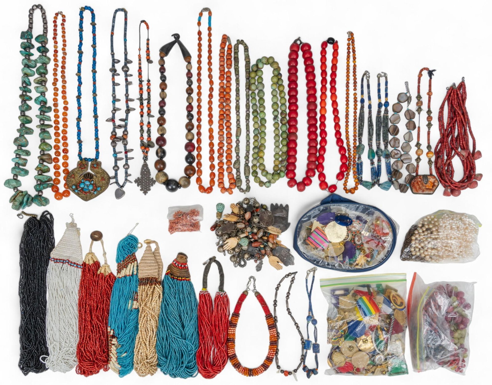 Collection of Costume Jewelry: Collection of costume jewelry, including fiesta medals and beaded necklaces Shipping available for this lot through our partner 4CL; please request a shipping quote at shipping@vogtauction.com or 
