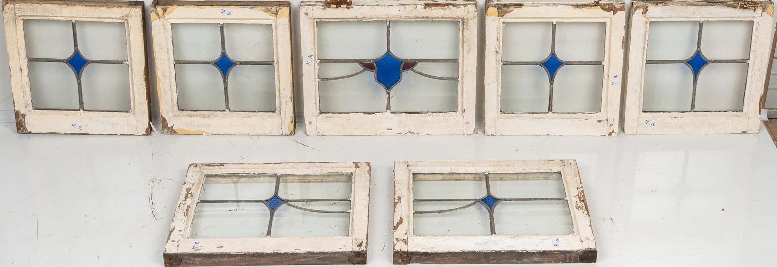 Set of (7) Stained Glass Panels: Set of seven stained glass panels, in wooden frames height 21 in. x width 17 in. x depth 2 in. / largest Shipping available for this lot through our partner 4CL; please request a shipping quote at shi
