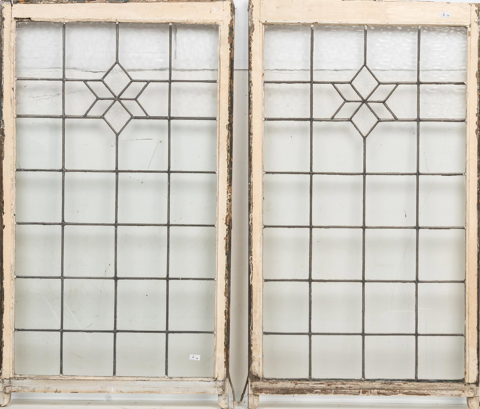 Pair of Leaded Glass Panels: Pair of leaded glass panels, in wooden frames height 56.5 in. x width 32 in. x depth 2 in. / each Shipping available for this lot through our partner 4CL; please request a shipping quote at shipping&#