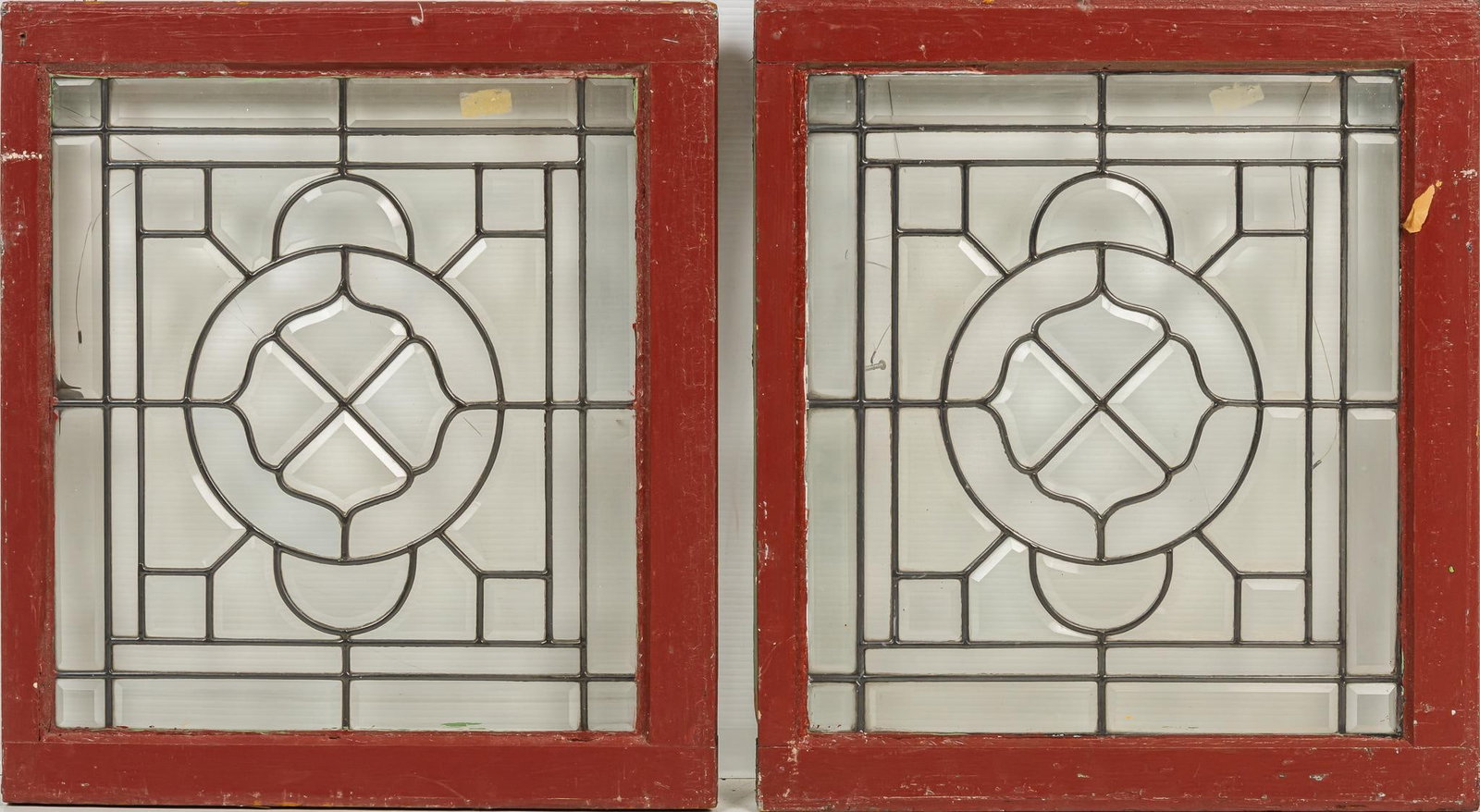 Pair of Leaded Glass Panels: Pair of leaded glass panels with beveled edges, in wooden frames height 24 in. x width 22 in. x depth 1.5 in. Shipping available for this lot through our partner 4CL; please request a shipping quote a