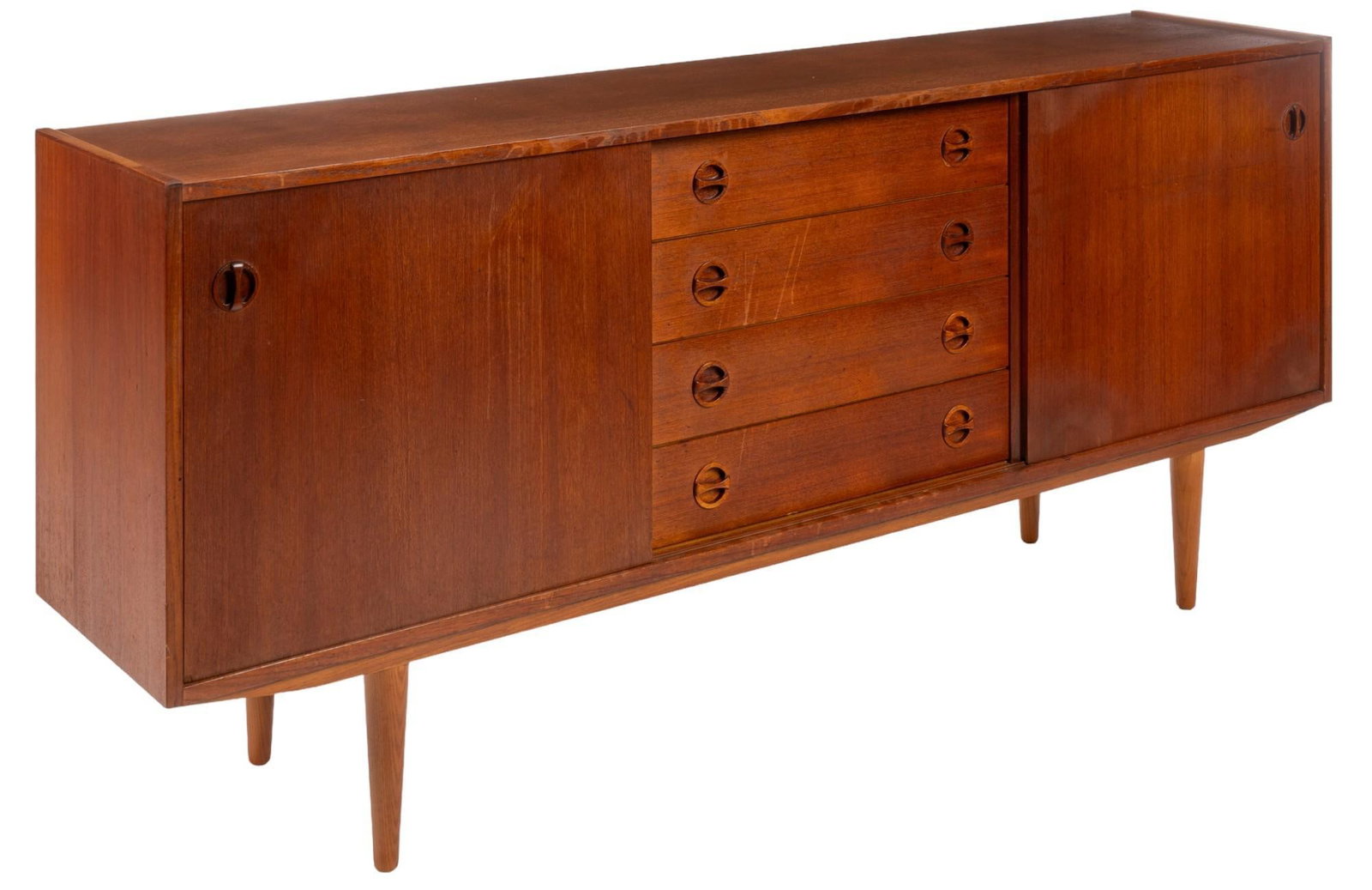 Danish Mid-Century Credenza: Danish mid-century credenza with middle stack of four frieze drawers with integrated wooden pulls, flanked by sliding cabinet doors that open to pair of adjustable shelves on the left, and single adju