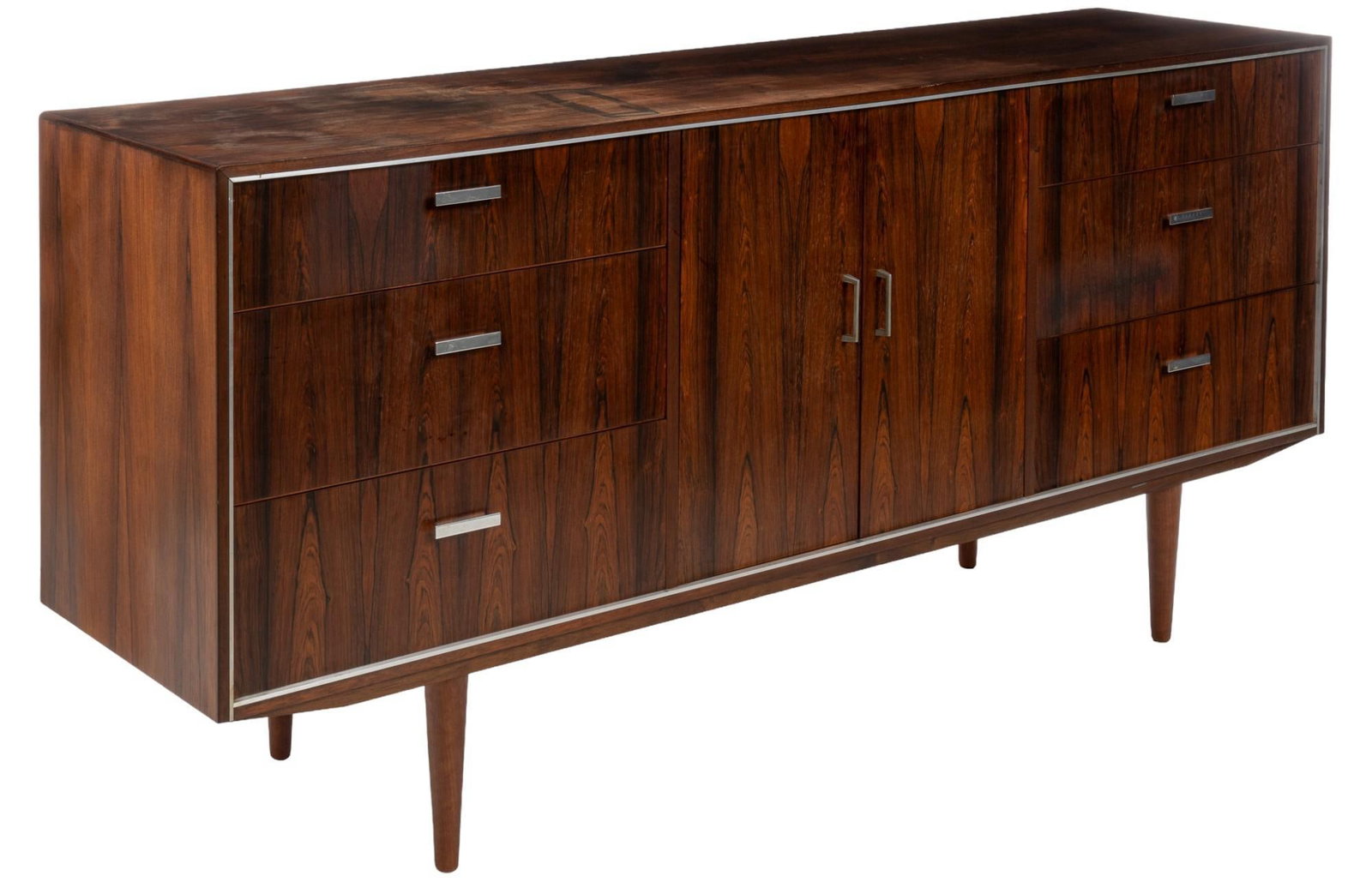 Danish Mid-Century Credenza: Danish mid-century credenza featuring central pair of cabinet doors with metal pulls that open to interior storage with small adjustable shelf on track, above single full width shelf, flanked by two s