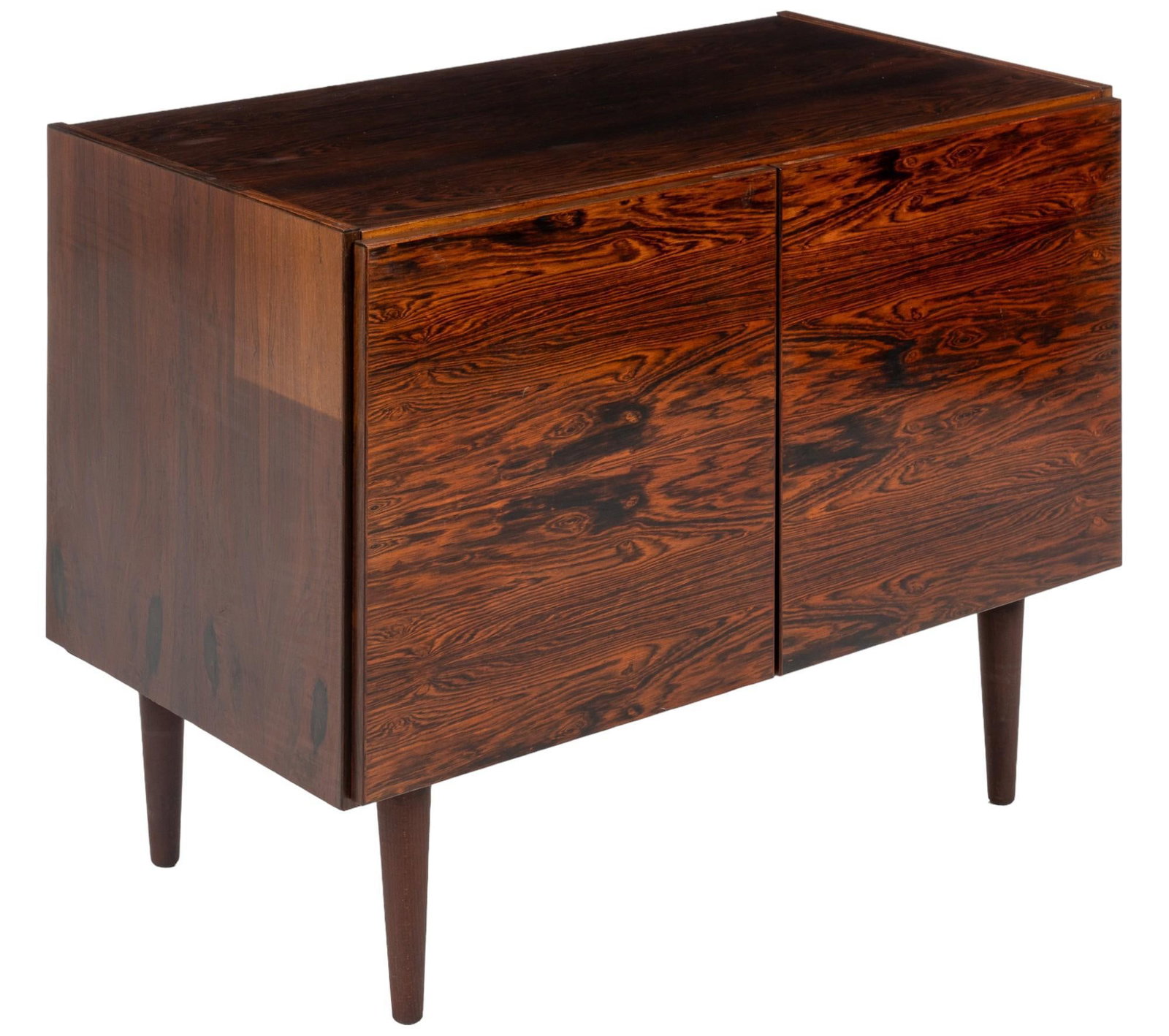 Royal Board (DNK) Credenza: Royal Board (Denmark) small credenza featuring pair of cabinet doors with carved grooved pulls that open to divided interior storage with single adjustable shelf on each side, supported on pin legs, m