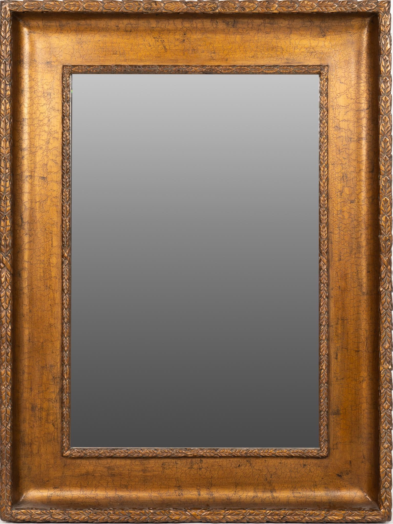Wall Mirror: Wall mirror featuring carved trim, and gold finish height 81 in. x width 61 in. x depth 8 in. €‹€‹€‹€‹€‹€‹€‹Provenance: Property from the collection of
