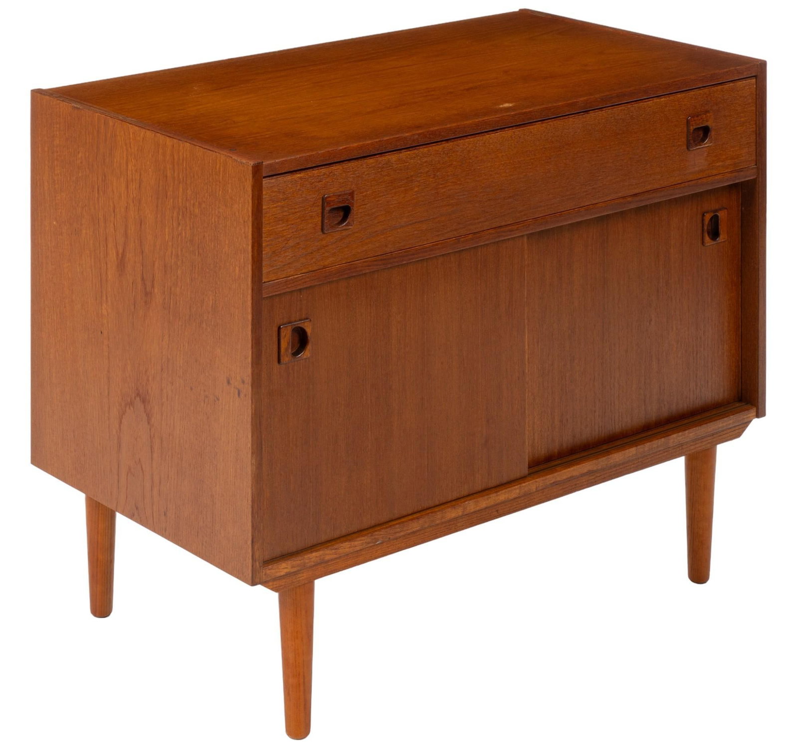 Danish Mid-Century Credenza: Danish mid-century credenza featuring top drawer with twin integrated wooden pulls above pair of sliding doors that open to interior storage, supported on pin legs height 29 in. x width 35 in. x depth