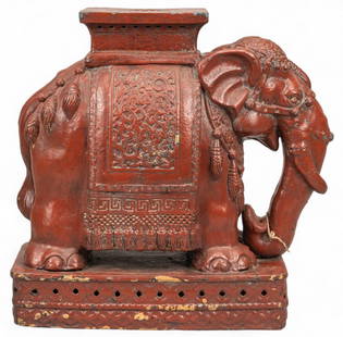 Glazed Elephant Garden Stool: Ceramic elephant garden stool with reddish brown glazing, with some chipping to glaze on bottom height 21 in. x width 10 in. x depth 22 in. Shipping available for this lot through our partner