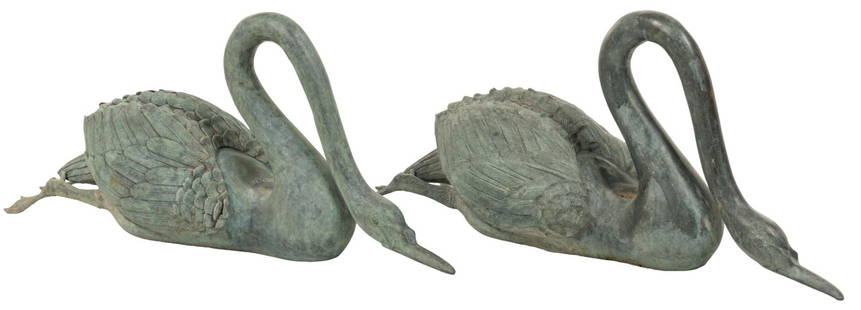 Pair of Bronze Swans: Pair of bronze swan garden sculptures with small recessed space behind bowed heads height 15.5 in. x width 11 in. x depth 25 in. Provenance: Property from a San Antonio, Texas estate 