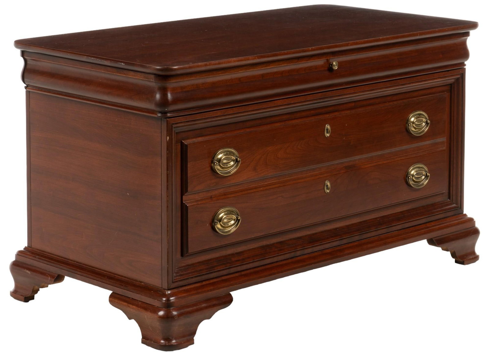 Jamestone Sterling (USA) Chest: Jamestone Sterling (USA) wooden chest featuring hinged lid opening to interior storage above pair of drawers with gold-toned metal pulls, framed by paneling, and supported on bracket feet height 24 in