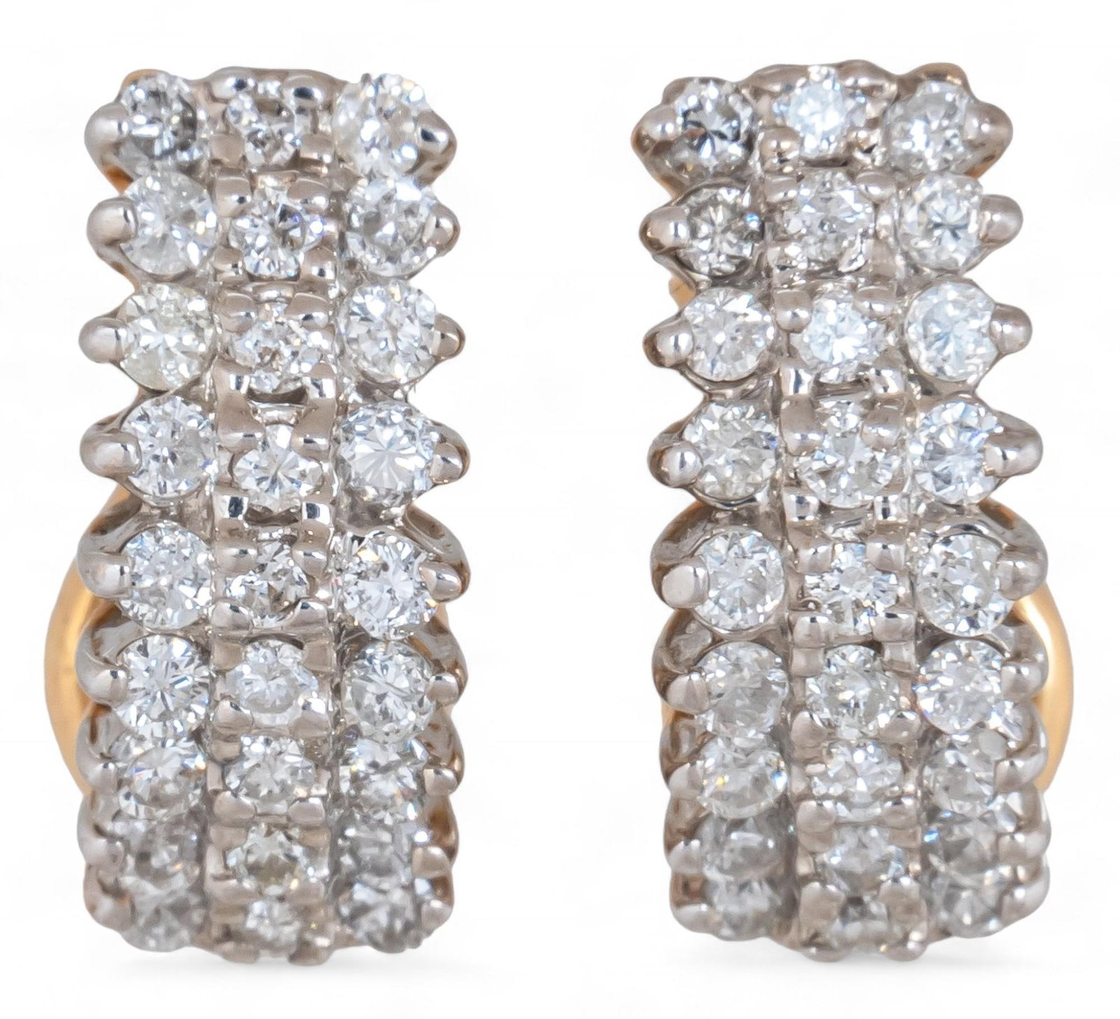 Pair of 14K Pave Diamond Earrings: Pair of 14K pave diamond earrings featuring three rows of diamonds with French clip backs, marked "14K" Length: .5 in Total weight: 5.8 g *All diamond or stone details including but not limite