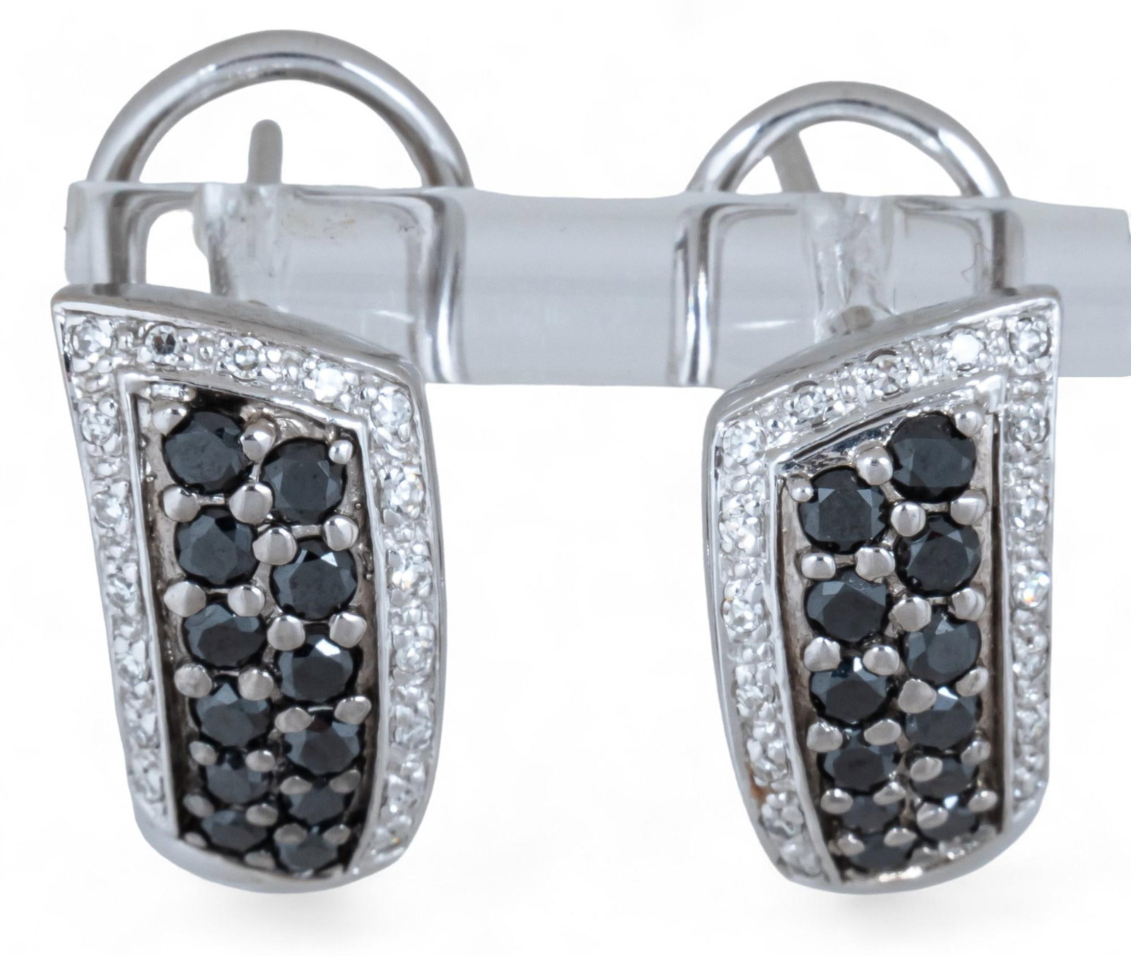 14K White Gold and Black Diamond Earrings: 14K white gold and black diamond earrings featuring pave set black diamonds and French clip backs, marked "14K" Length: .75 in. Total weight: 6.1 g *All diamond or stone details including but 