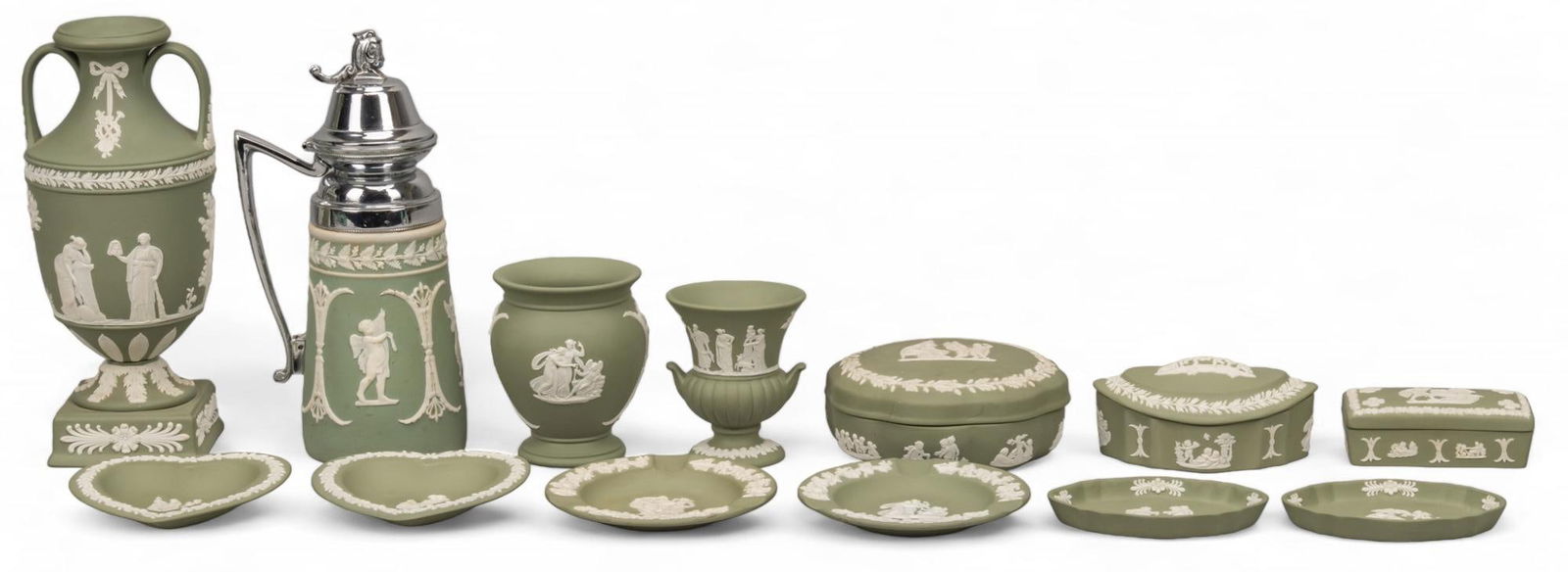Collection of (13) Wedgwood (ENG) Sage Green Jasperware: Collection of thirteen Wedgwood (Stoke-On-Trent, England) sage green jasperware, each having a Neoclassical design in relief, includes six plates, two heart-shaped, two circular, two oval, three lidde