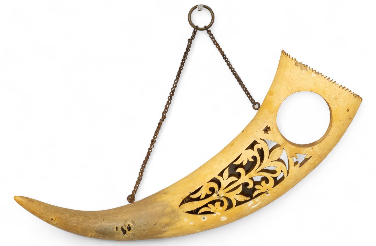 Carved Horn Folk Art: Carved horn folk art featuring incised scrolled motifs, with metal chain accent height 6 in. x width 12 in. x depth 4.5 in. Provenance: The collection of Mickey & Barbara Hunter, San Antonio, Texa