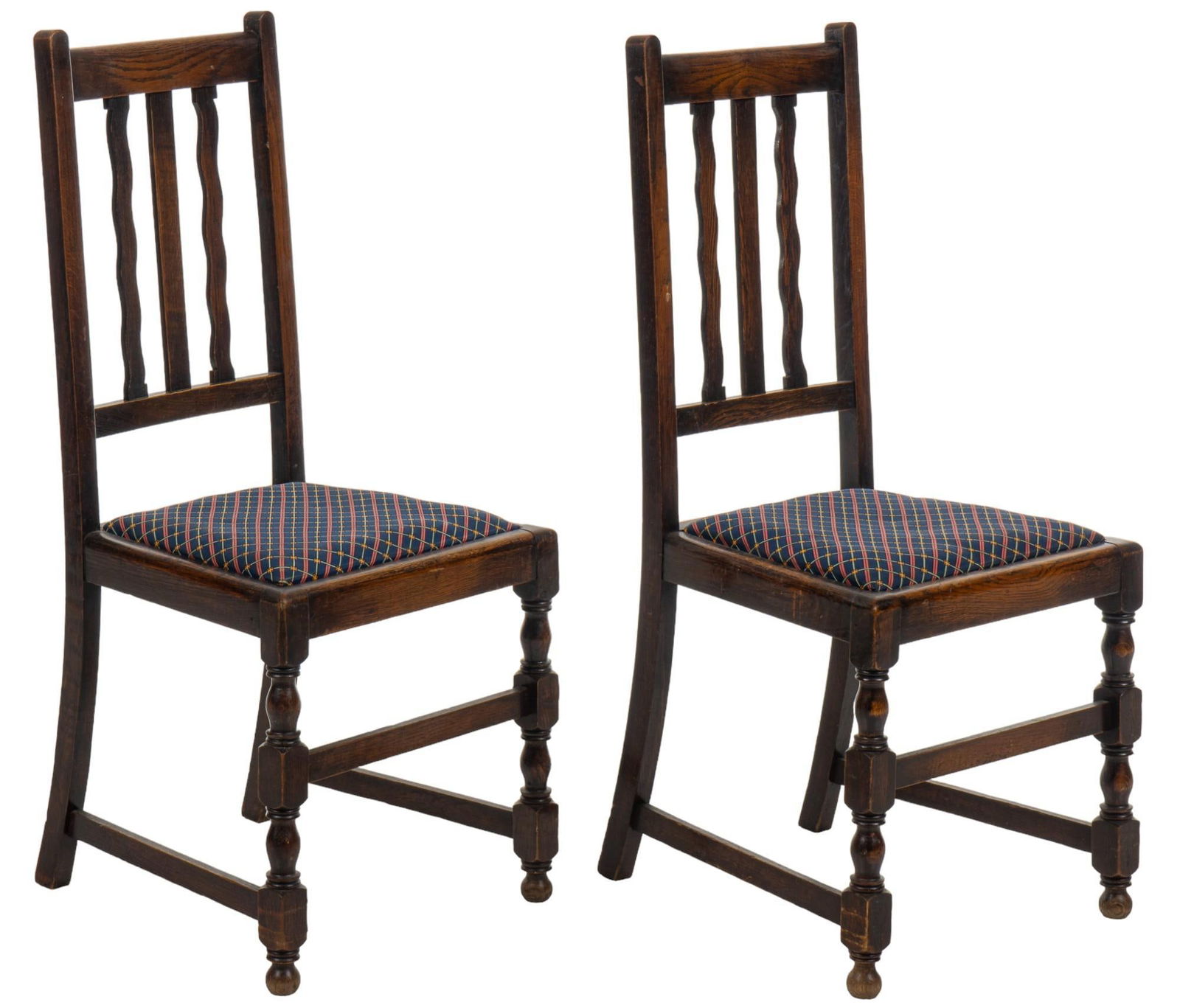 Pair of Turned Chairs: Pair of turned chairs featuring back with wavy slat detail, cushioned seat with plaid fabric upholstery, on turned front legs with stretcher height 40.5 in. x width 17 in. x depth 18 in. Provenanc