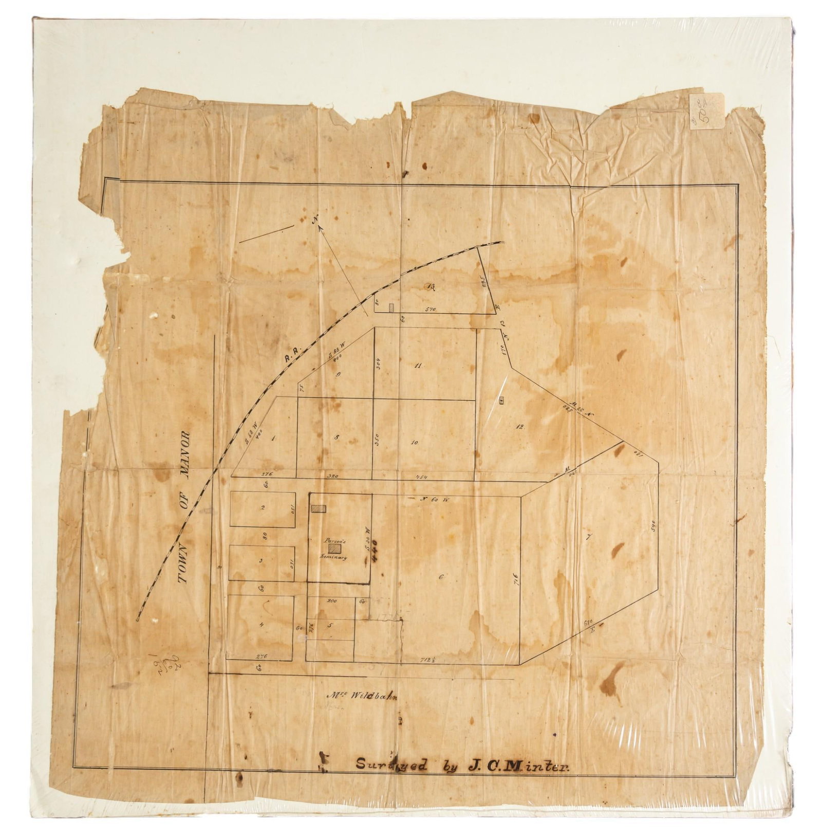 Vintage Map of Manor, Texas: Vintage map of the Town of Manor Texas, surveyed by J.C.Minter, date unknown, resting on cardboard, sealed in plastic height 20 in. x width 21 in. Provenance: The collection of Mickey & Barbara Hu