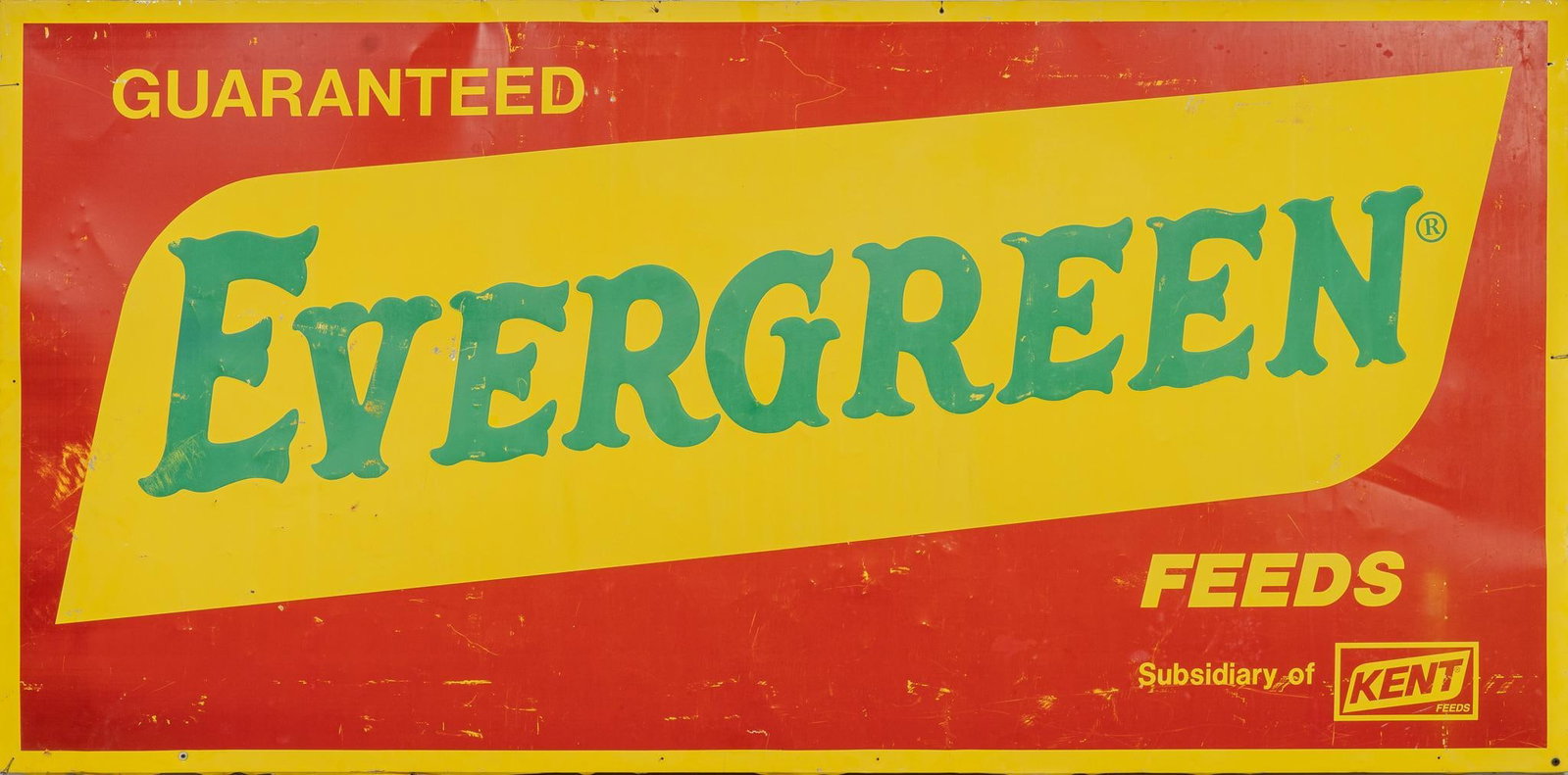 Evergreen Feeds Sign: Evergreen Feeds sign stretched over wooden frame height 46.5 in. x width 94 in. x depth 1 in. Provenance: the Estate of Otis Hibler, former mayor of Hill Country Village (San Antonio, Texas) Shipping 