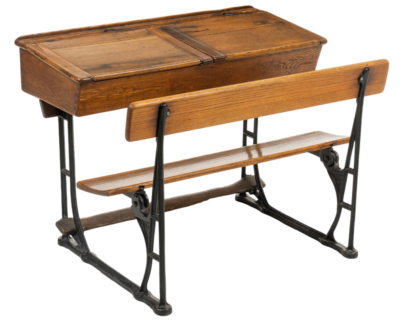 Two Seat Student's Desk: Vintage two seat wooden student's desk, top opens to reveal interior storage, supported by metal frame height 29 in. x width 40 in. x depth 31 in. Shipping available for this lot through our pa