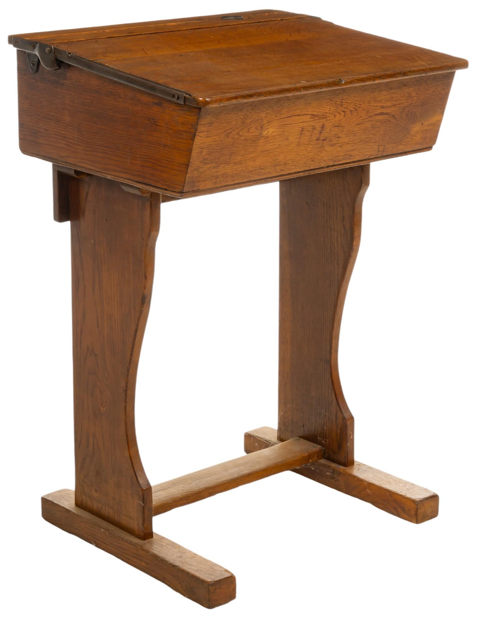 Wooden School Desk: Wooden school desk with hinged top opening to interior storage height 31.5 in. x width 23 in. x depth 18.5 in. Provenance: Property from the collection of a Fredericksburg, Texas gentleman Shipping