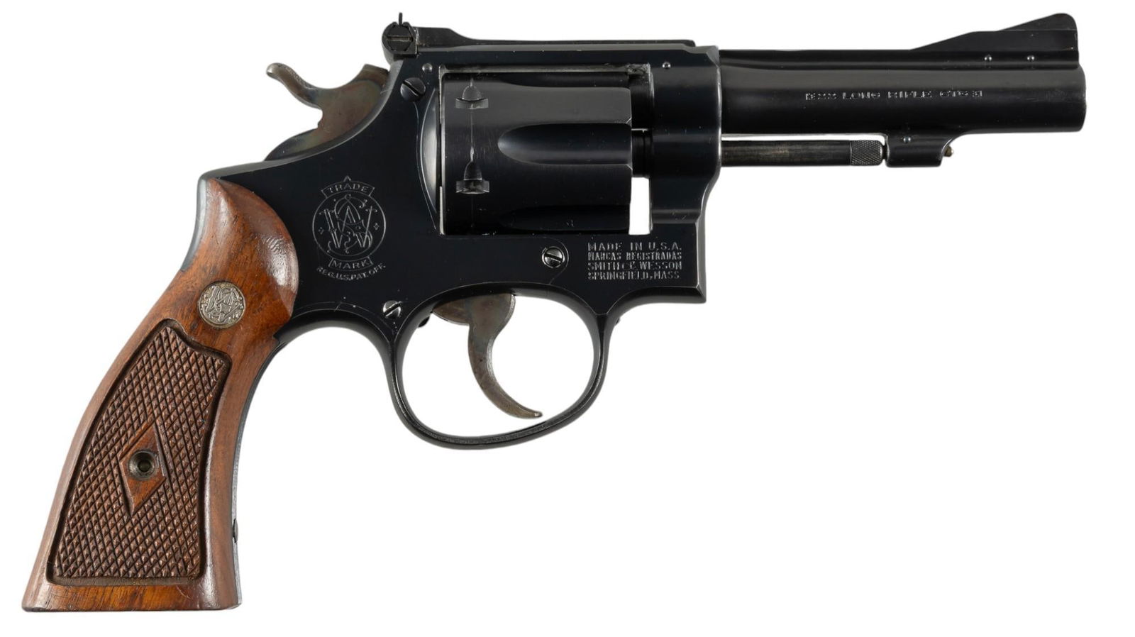 Smith & Wesson K-22 Combat Masterpiece 22 LR Revolver: Serial: K197304 Manufacturer: Smith & Wesson (c. 1949-1957) Model: K-22 Caliber: 22 LR Barrel length: 4 in. OAL: 9 in. Condition: Good; light wear & handling marks throughout; barrel & fra