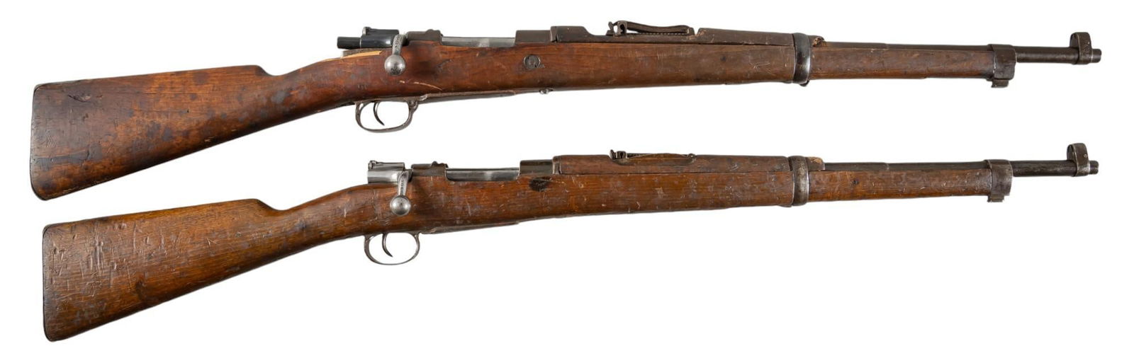 Pair of Spanish Oviedo M1916 7mm Mauser Rifles: Serial: (1) G8110; (2) N6932 Manufacturer: Fabrica de Armas Oviedo-Spain c. 1922 Model: M1916 Caliber: 7mm Mauser Barrel length: 22 in. OAL: 41.5 in. Condition: (1) Poor; wood stock & handguard ha