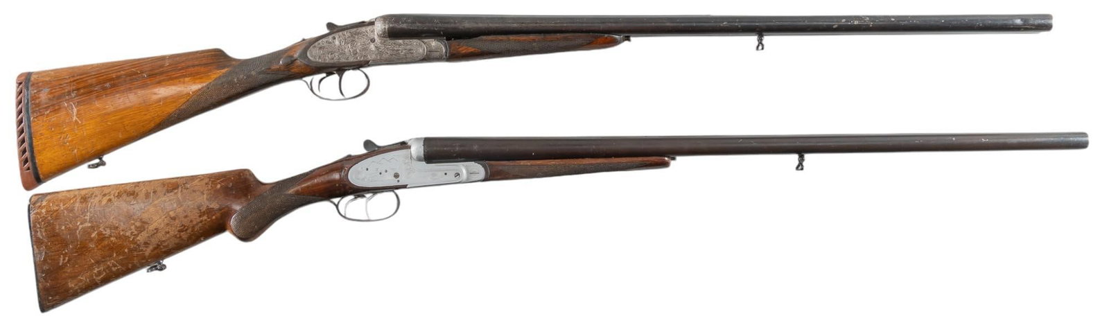 Pair of Spanish 12 Gauge SXS Shotguns: Serial: (1) 151400; (2) V14219 Manufacturer: (1) Eibar-Spain / CAI; (2) LIG Elgoibar-Spain / CAI Model: SXS Caliber: 12 Gauge Barrel length: (1) 27.5 in.; (2) 28 in. OAL: (1) 44.5 in.; (2) 44 in. Cond