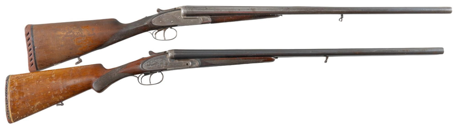 Pair of Spanish 12 Gauge SXS Shotguns: Serial: (1) FN158660; (2) V7632 Manufacturer: (1 & 2) Eibar-Spain / CAI Model: SXS Caliber: 12 Gauge Barrel length: (1) 27.5 in.; (2) 27.5 in. OAL: (1) 44.75 in.; (2) 44.25 in. Condition: (1) Fair