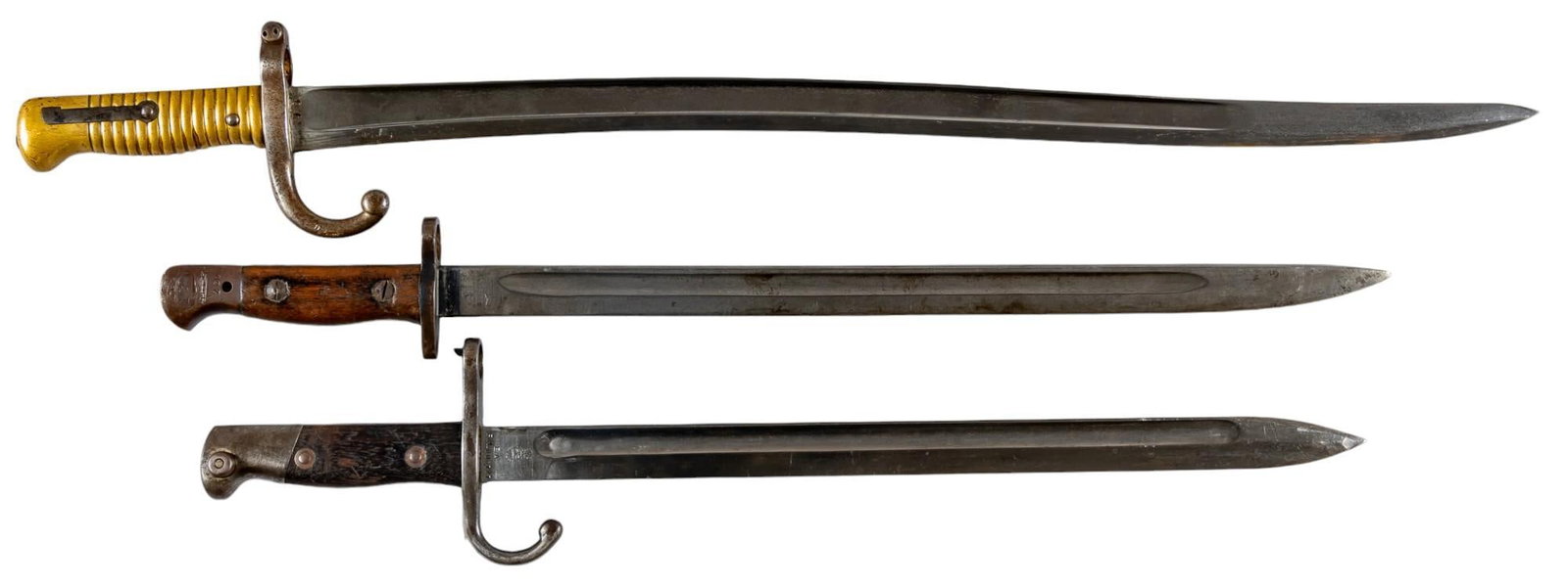 Collection of 3 Pre-WWI European Bayonets W/ Scabbards: Includes: -Argentine Mauser M1909/47 bayonet w/ scabbard; matching SNs; 21 in. long w/ scabbard -French St. Etienne M1866 Chassepot bayonet w/ scabbard; non-matching; 28 in. long w/ scabbard -British 