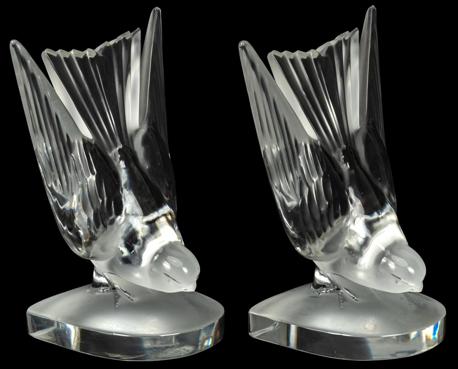 Lalique Crystal Swallow Book Ends: Pair of Lalique crystal swallow book ends height 6.5 in. x width 4.5 in. x depth 3.5 in. Provenance: Property from the home of a prominent Terrell Hills, Texas businessman Shipping available for this 