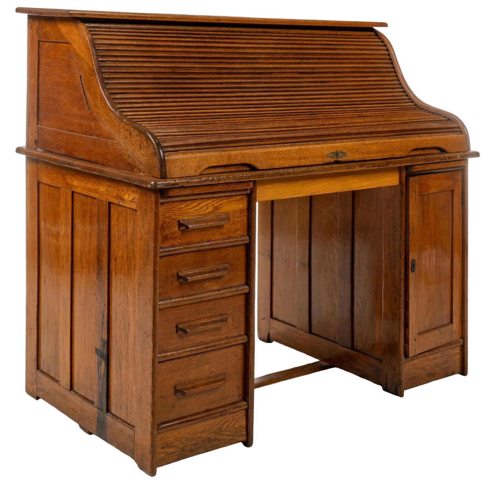 Roll Top Desk: Roll top desk featuring tambour door that slides upward to reveal fitted storage, with pair of small drawers overlooking desktop, supported by two pillars, with left side having stack of four drawers