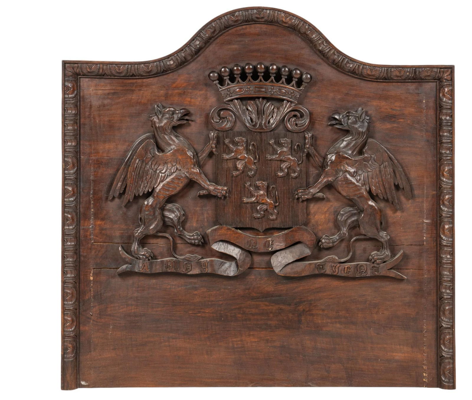 Coat of Arms Carved Wood Headboard: Coat of arms carved wood headboard featuring central crest of arms height 50 in. x width 51 in. x depth 3 in. Provenance: Property from the monumental lifetime collection of a distinguished Dallas,