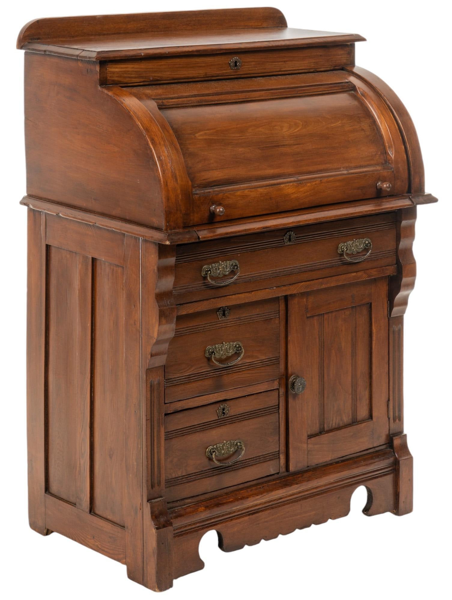 Wooden Davenport Cabinet: Wooden Davenport cabinet with roll top cover opening to several cubbies and a small drawer over writing surface, over three drawers and a cabinet door opening to interior storage, with carved skirt ba