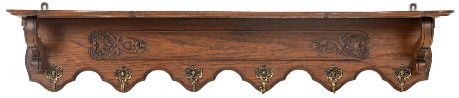 Carved Wood Coat Rack: Carved wood coat rack featuring six metal coat hooks, and carved border detail height 13 in. x width 51.5 in. x depth 10 in. Provenance: Property from the monumental lifetime collection of a disting
