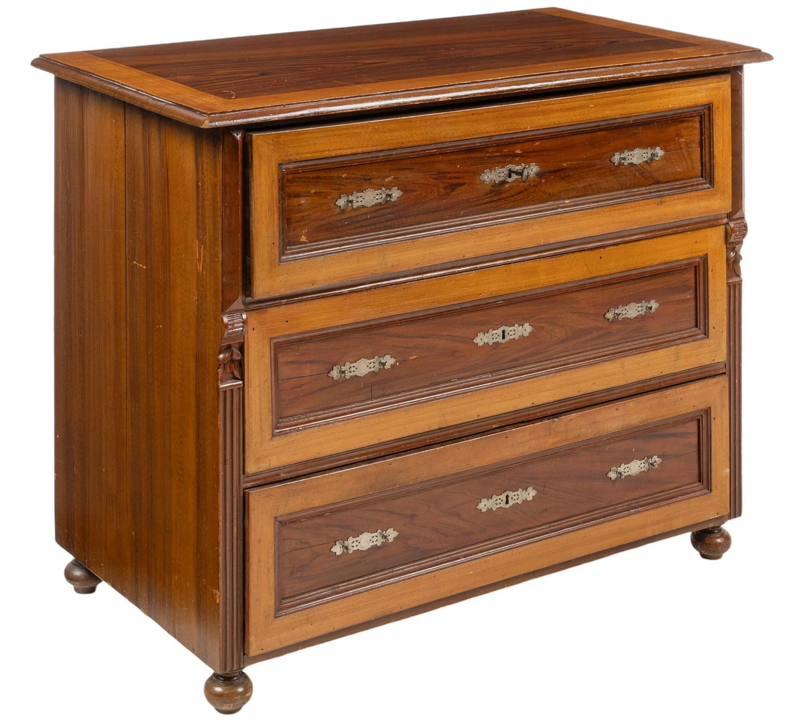 Wooden Dresser: Wooden dresser with inlaid top above stack of three paneled drawers with metal escutcheons, flanked by carved and fluted details, resting on bun feet height 37 in. x width 47 in. x depth 24 in. Condit