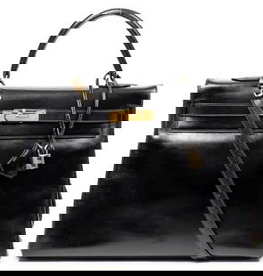 Hermes Kelly Retourne: Hermes Kelly Retourne of black box leather, with black leather straps and golden hardware, includes strap, cadenas, keys in clochette, and dust bag; marked Stamp V in Circle (1992) 14 in. x 10 in.