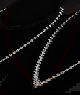14K White Gold Diamond Riviera Necklace: 14K white gold diamond Riviera necklace featuring 9.20 ctw in total diamonds, having larger diamonds to the center of the necklace, with graduated diamonds moving up chain (Color I, Clarity SI),