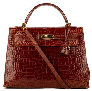 Hermes Kelly Sellier: Hermes Paris, Kelly Sellier handbag of miel porosus crocodile leather, with crocodile leather handle, and golden hardware, includes removable crocodile leather strap; marked Stamp D inside square 