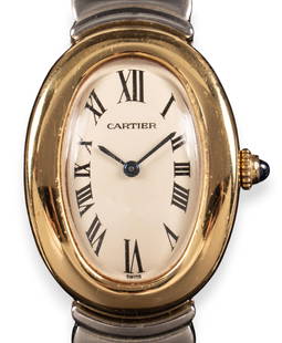 Cartier Baignoire Watch: Cartier baignoire watch, 23 mm, stainless steel and 18K yellow gold, quartz movement Circumference: 7.25 in. Total weight: 67.0 g