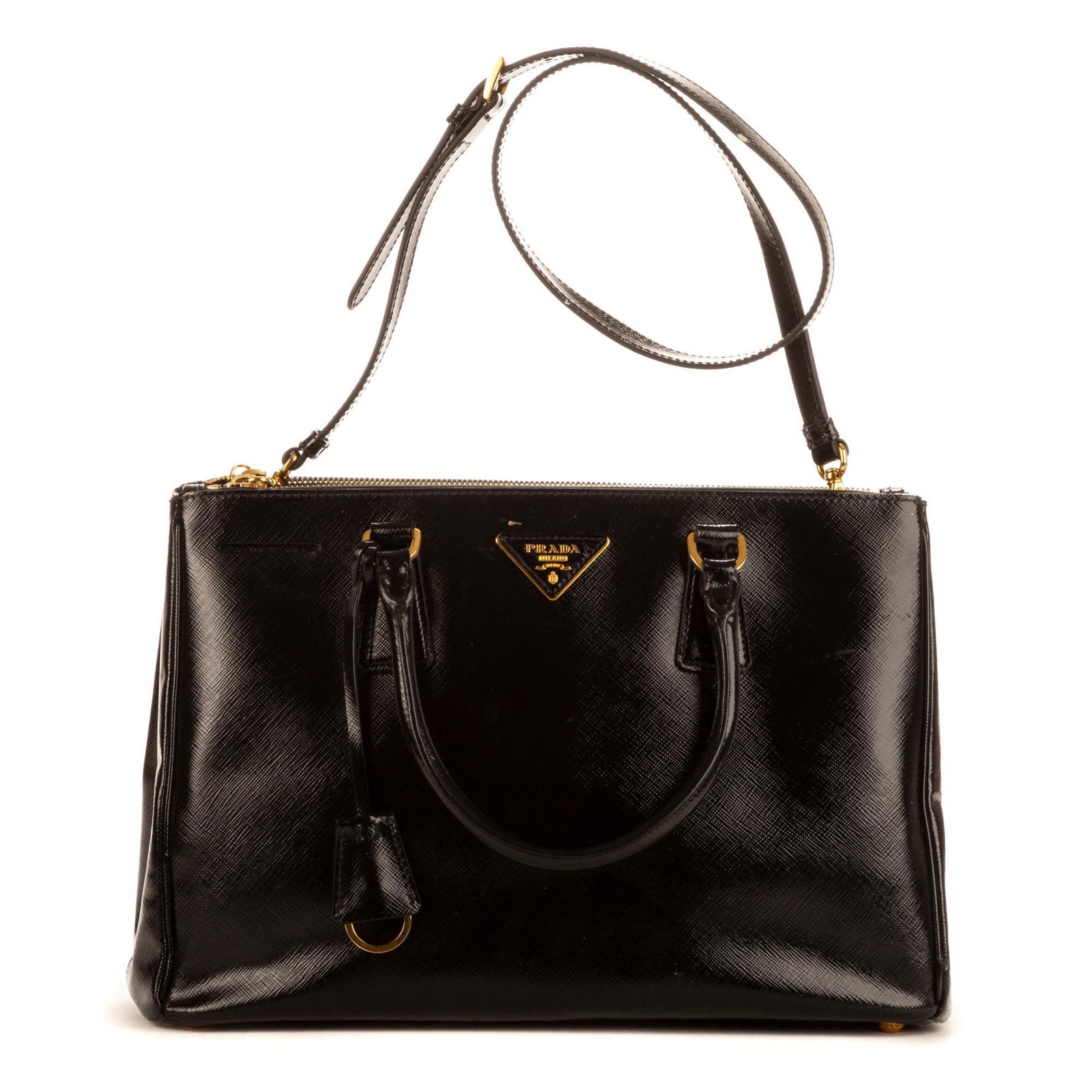 Prada (ITA) Galliera: Prada (Italy) Galliera handbag of black Saffiano leather, and black leather handles, with golden hardware, includes strap, and key holder 13 in. x 9 in. x 8 in. Condition A; excellent condition, s