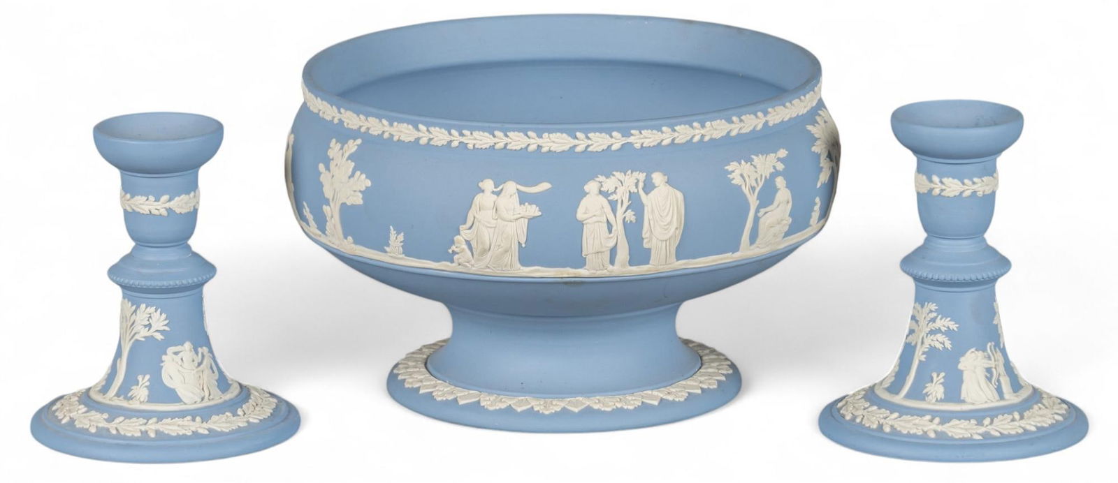 Collection of (3) Wedgwood (ENG) Pale Blue Jasperware: Collection of three Wedgwood (England) pale blue jasperware, each having a Neoclassical design in relief, includes two candlesticks and one footed bowl height 5 in. x width 8.5 in. x depth 8.5 in. /