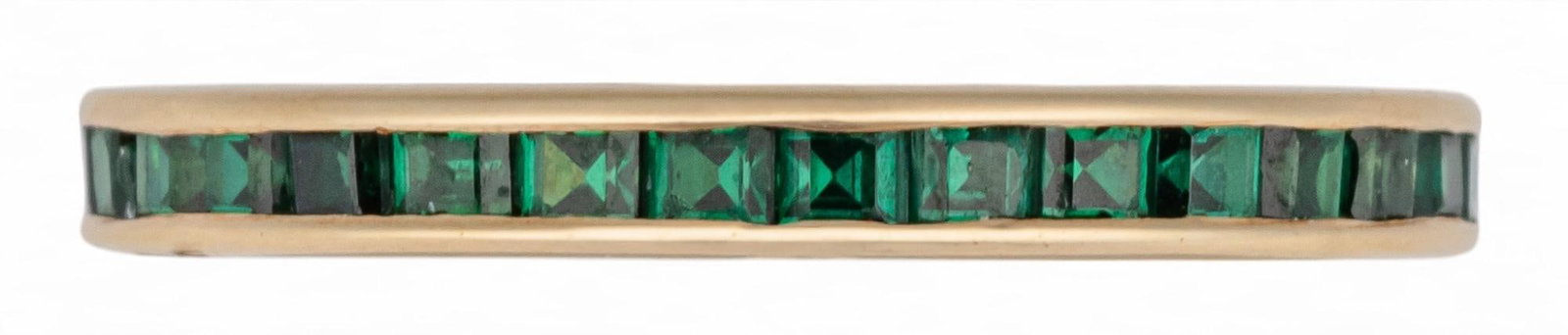 14K Emerald Band: 14K gold emerald band featuring row of inlaid emeralds, size 6.5, unmarked Total weight: 2.0 g