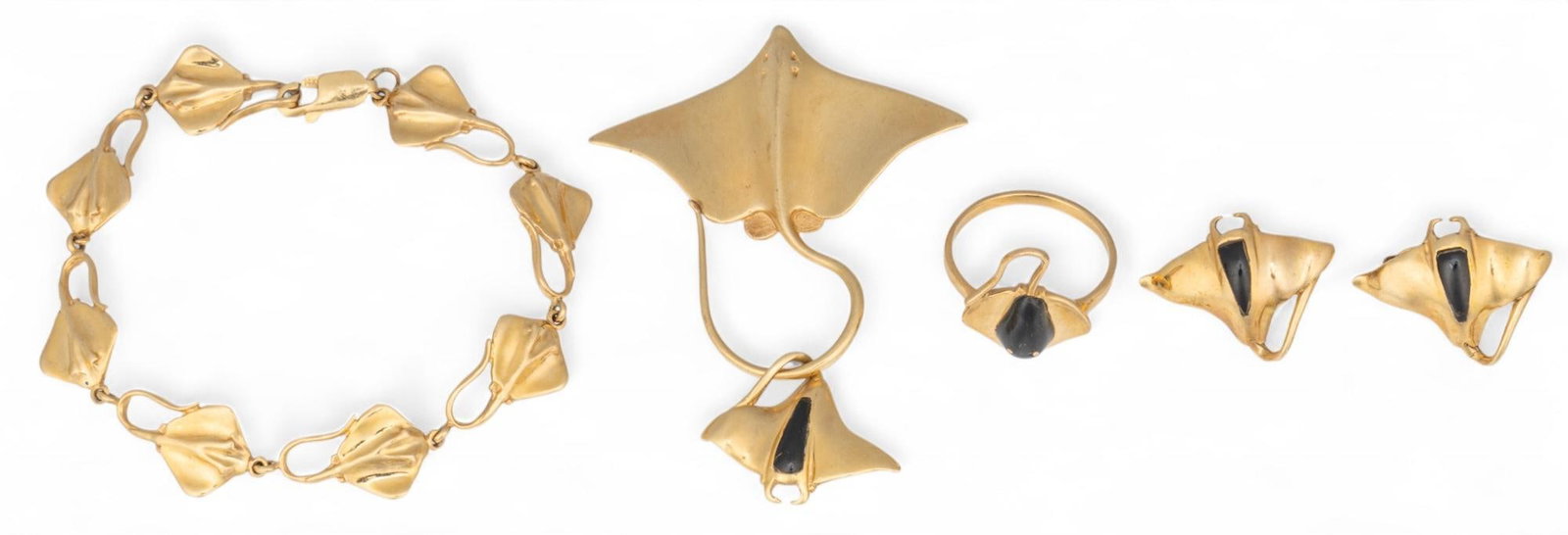 Collection of 14K Stingray Jewelry: Collection of 14K gold and onyx stingray jewelry including bracelet with stingray chain, marked "14K", stingray pendant with drop, marked "14K", stingray clip-on earrings, marked "