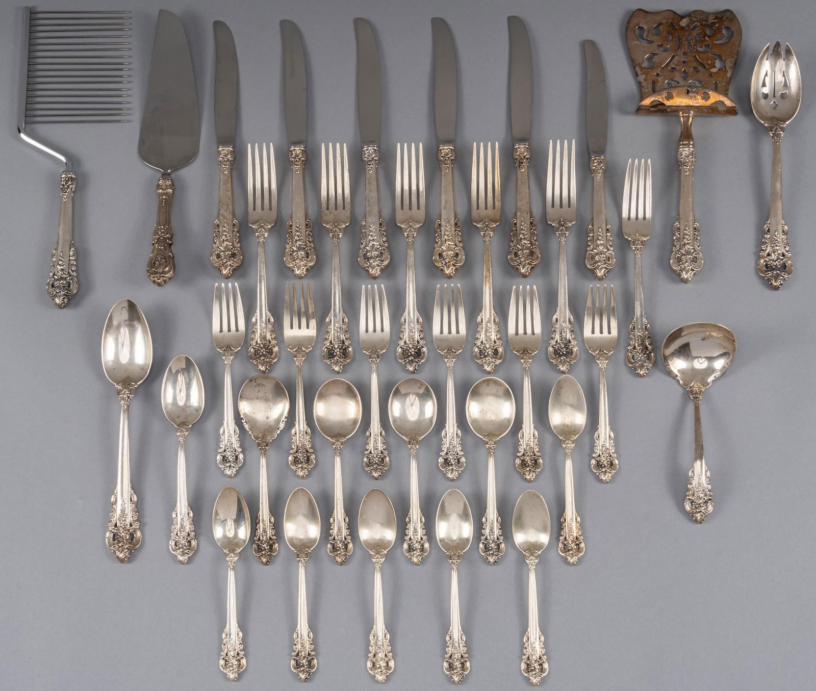 "Grand Baroque" by Wallace Silversmiths Partial Sterling Silver Flatware Set: "Grand Baroque" by Wallace Silversmiths partial sterling silver flatware set, no monogram or removal, marked, 35 pieces total, to include: 5 dinner knives, 9.75 in. 6 dinner forks, 8 in. 1 lu
