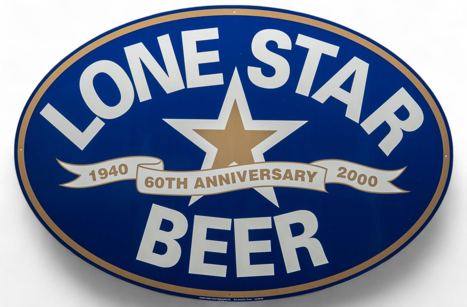 Lone Star 60th Anniversary Sign: Lone Star Beer (Texas) metal sign, featuring banner and messaging celebrating 60 years of brewing, single sided, with white lettering on blue field, manufactured in San Antonio height 23.5 in. x wid