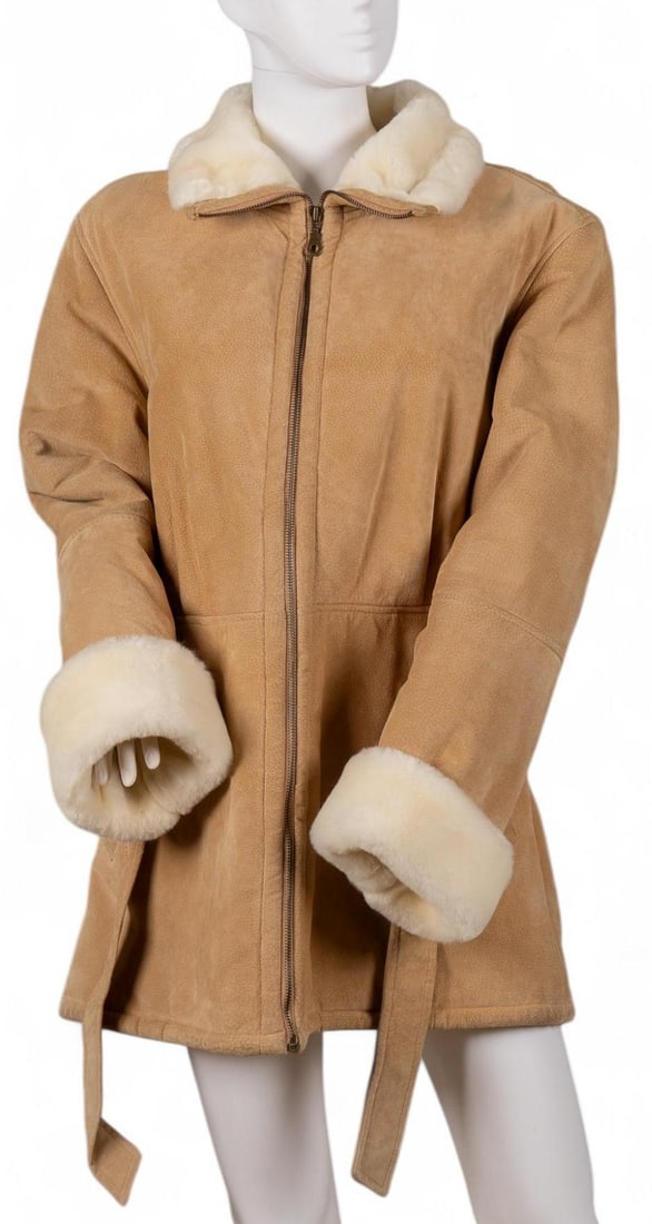 Wilsons Leather Ladies Coat: Wilsons leather ladies coat featuring acrylic fur lining length from top of collar: 33 in. shoulder width: 17 in. sleeve length: 22 in. Condition AB; very good condition, shows regular signs of wear P