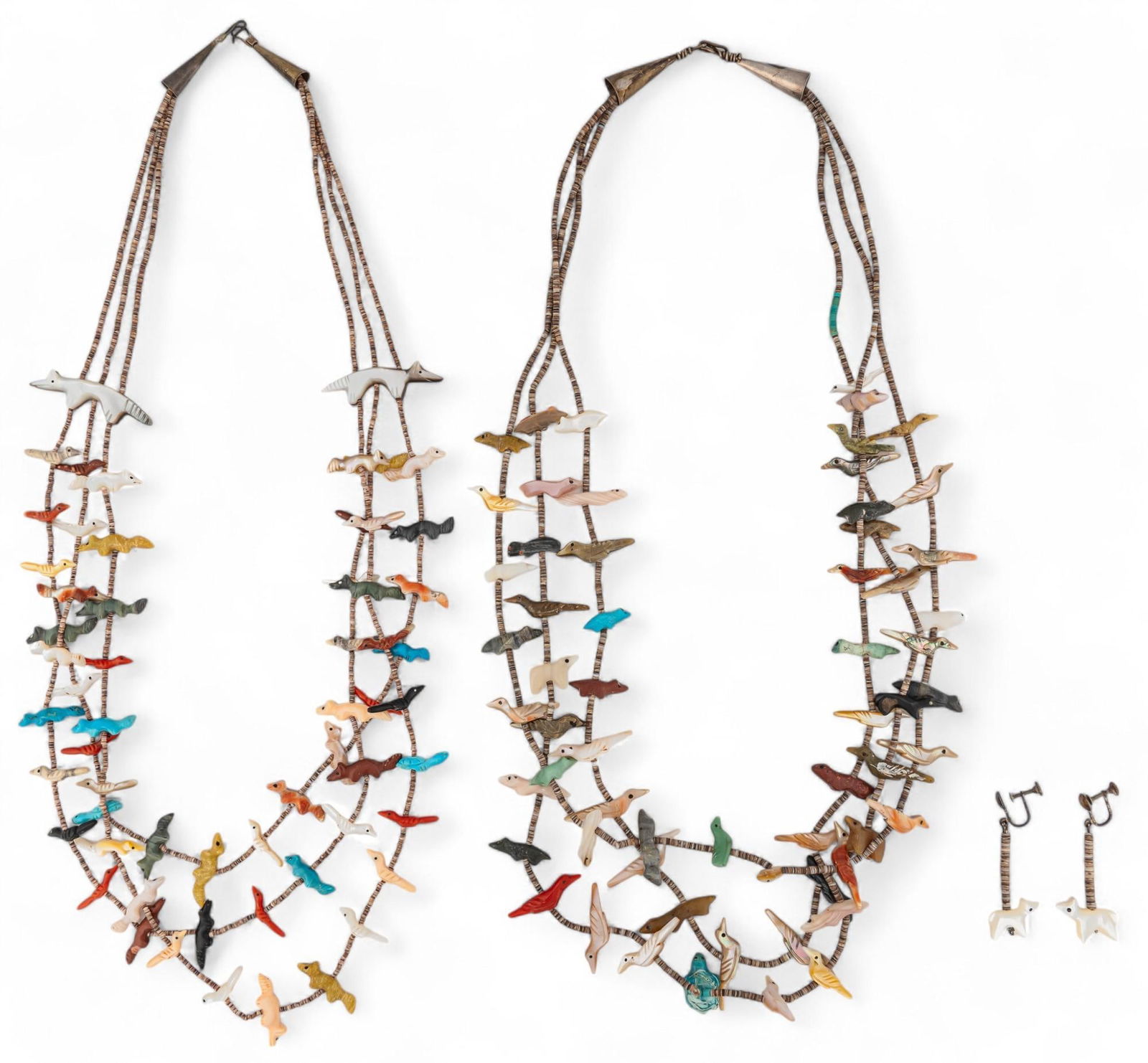 Collection of Fetish Necklaces: Collection of fetish necklaces including two multi-strand necklaces with animal fetish charms along beaded chain, with matching set of dangle earrings, unmarked Chain length: 28 in. Total weight: 1