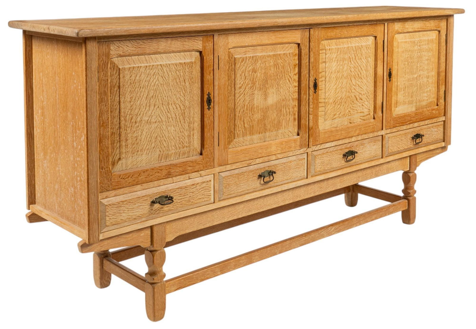 Henning Kjaernulf (DNK) Mid-Century Credenza: Henning Kjaernulf (Denmark) mid-century oak credenza having oversize top above four paneled cabinet doors with metal escutcheon, with left door opening to interior with two drawers inside, middle pair